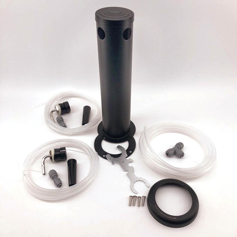 Draft beer tap kit components laid out: black cylindrical housing with mounting ring, several clear tubing runs, fittings, wrench, screws, and small hardware ready for installation.