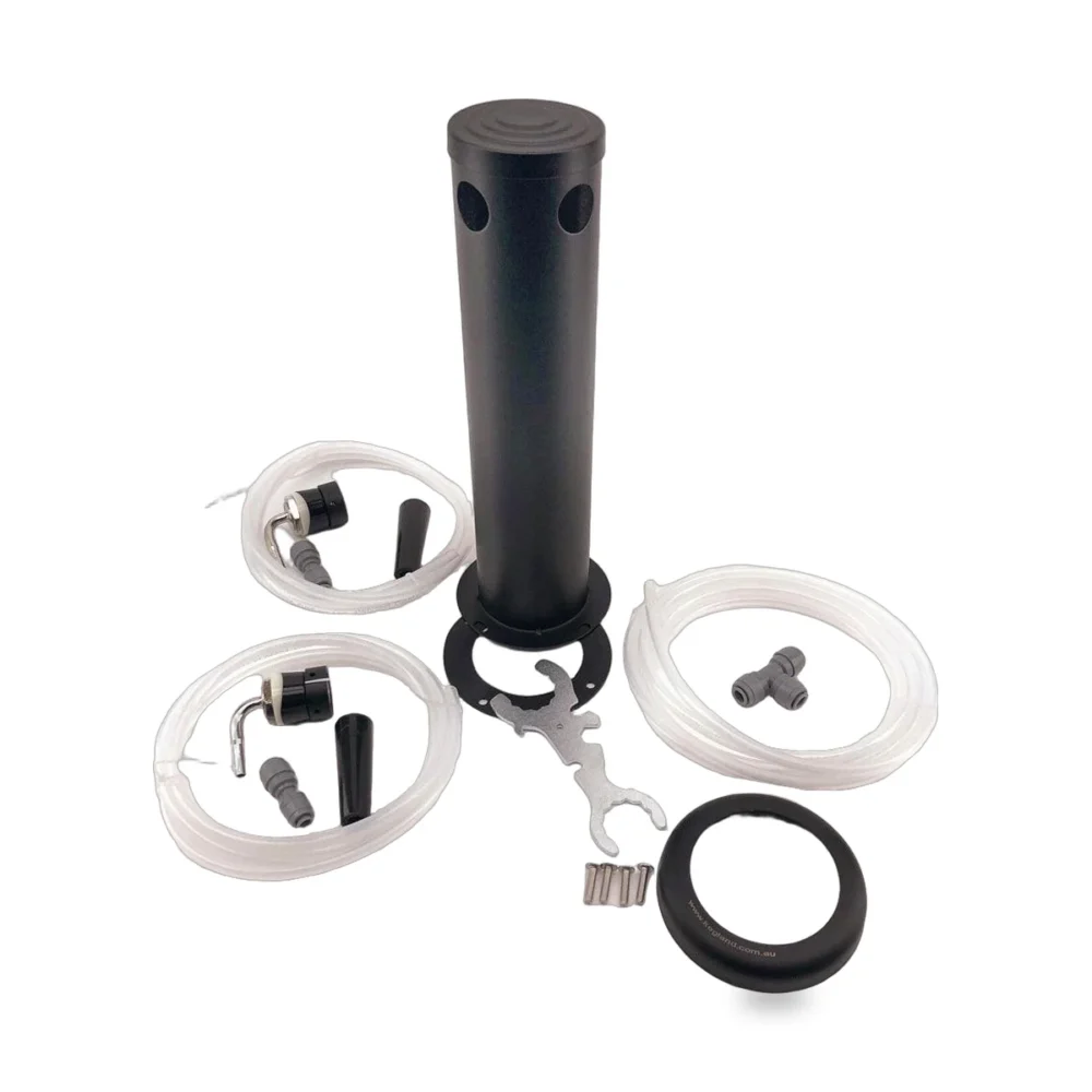 Draft beer tap kit components laid out: black cylindrical housing with mounting ring, several clear tubing runs, fittings, wrench, screws, and small hardware ready for installation.